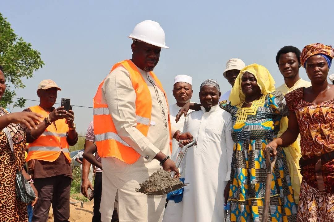 Sorie Sulaiman Sesay at a project groundbreaking in a hard hat